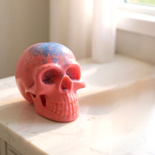 Charger l'image dans la galerie, pink skull-shaped glycerin soap bar on marble surface near window light