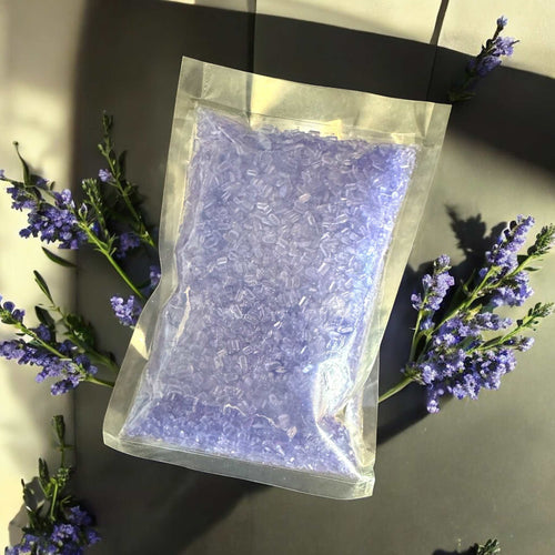 Magnesium bath salts packet surrounded by lavender sprigs for muscle relaxation.