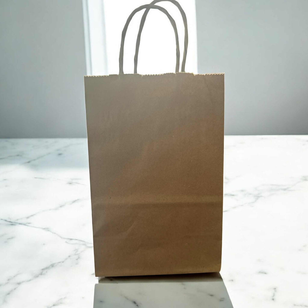 Colorful surprise bags containing five stylish hair scrunchies, perfect for any hairstyle.
